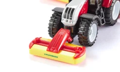 Steyr mit Pöttinger Mähwerkskombination